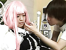 Lovely Japanese Chick Lets Her Handsome Boyfriend Touch Her Boobs And Rub Her Legs On A Blue Bed Wearing Her Pink Wig And Black