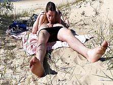 Nudist Couple Enjoying Blowjob At The Beach