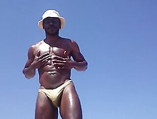 Troy Oiling Up At The Beach