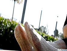 Mistress Sexy Feet In White Fishnet Pantyhose In The Park