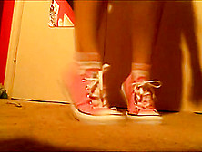 Girl In Pink Converse Removes Shoes And Socks To Expose Bare Feet