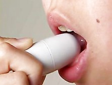 Nice-Looking Japanese Gal Licking A Mini Sex Tool