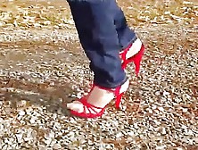 Seductive Shemale Loves Walking Outdoors In Her Red High Heels