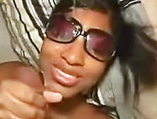 Black Babe In Sunglasses Jacks Off A Cock
