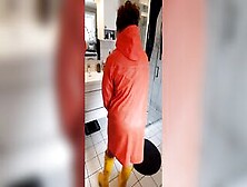 Trying On Raincoats Inside Latex Boots - Long Boobies