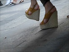Sexy Feet In Wedges High Heels Under A Bench