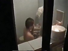 Voyeur Captures The Neighbor Asian Girl Showering And Masturbating