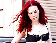 Slender Spicy Redhead Is Posing In A Hot Rod