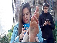 Girl Flaunting Her Beautiful Feet While Chilling In Public - Dark Haired