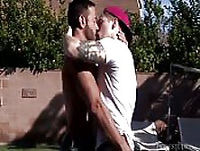 Two Men Passionately Kiss