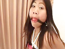 Asian Babe Tied To A Chair