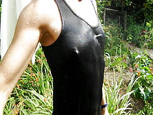 Refreshing & Wetting T-Shirt And Black Shorts In Hose In The Garden...