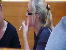 Confident Blond Smoking In A Meeting