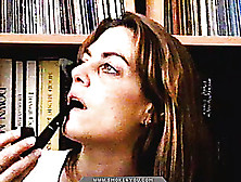 Long-Haired Lady Smoking Pipe In The Library