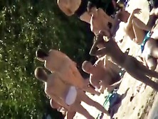 Young Nudists Take Off Their Clothes To Soak Up Some Sun On