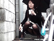Hot Japanese Lassie Is Wearing Sexy Nylon Stockings,  While Peeing In Parking Lot