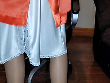 Long Lined Orange Satin Skirt With A White Silky Half Slip.