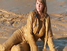 Brunette Getting Muddy In Jeans