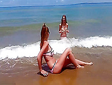 Two Girls Having Fun On The Beach