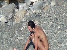 Alluring Lady Is Posing On The Nudist Beach