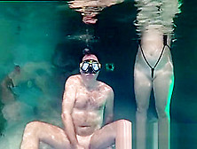 Couple Having Fun Underwater.