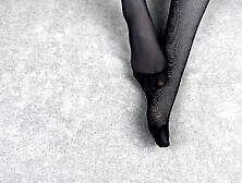Mistress Caresses Her Feet In Black Nylon Pantyhose