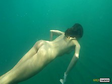 Nude Model Swims On A Public Beach In Russia