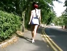 Filming Up A Leggy Redheads Skirt In Public