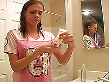 Dashing Teen Fairy Applies Her Make Up In Front Of The Mirror