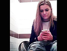 Amateur Girl Is Playing With Phone Pissing On Toilet