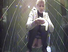 Alluring Blonde Is Peeing On The Toilet