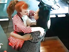 Redhead And Brunette Eat And Play On Kitchen Counter