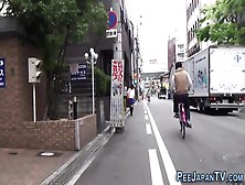 Japanese Ho Pisses Street