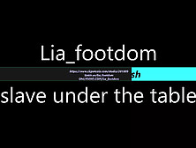 Foot Slave Lies Under The Table