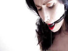 Fully Nude Dark Haired With A Gag Into Her Mouth Bound With Ropes