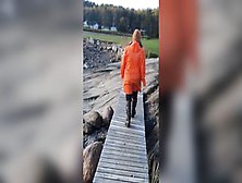 Taking A Stroll Inside Orange Raincoat And Latex Boots