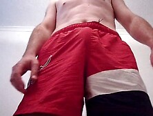 Handsome Guy In Red Shorts Playing With His Hard Cock And Stroking