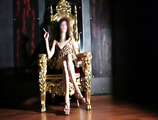 Young Dominatrix Sitting On Her Throne