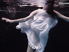 Redhead Beauty In The Underwater White Dress