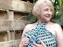 Hot Mature Blonde Teases With Her Huge Tits Outdoors
