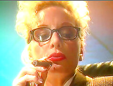 Blonde Mature Lady With Glasses Smokes A Cigar And Plays With Her Tits