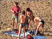 Nudist Family Leaving The Beach