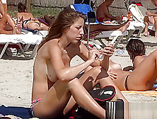 Two Teens Work On Their Tanlines