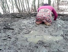 In A Mini Dress She Is Playing In The Mud