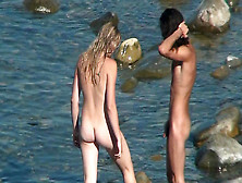 Two Babes Are Posing Naked On The Beach