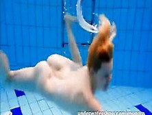 Cute Lucie Stripping Underwater