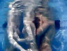 Horny Brunette Lesbians Pleasure Each Other In The Pool