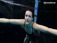 Beautiful Girl Swims And Smiles Underwater
