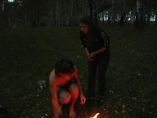 Dominant Broad Tortures Her Slave In The Woods