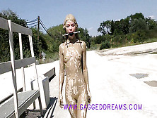 Lovely Nubile Walking Ball-Gagged Outdoor After A Mudbath